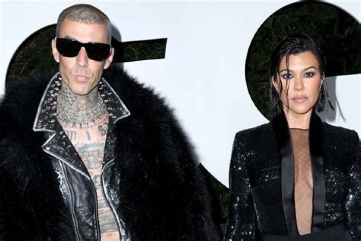 
Kourtney Kardashian and Travis Barker Celebrate New Year’s Eve in Matching Pajamas and Party Gear 